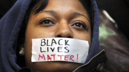 Black-Lives-Matter-taped-over-young-Black-womans-mouth